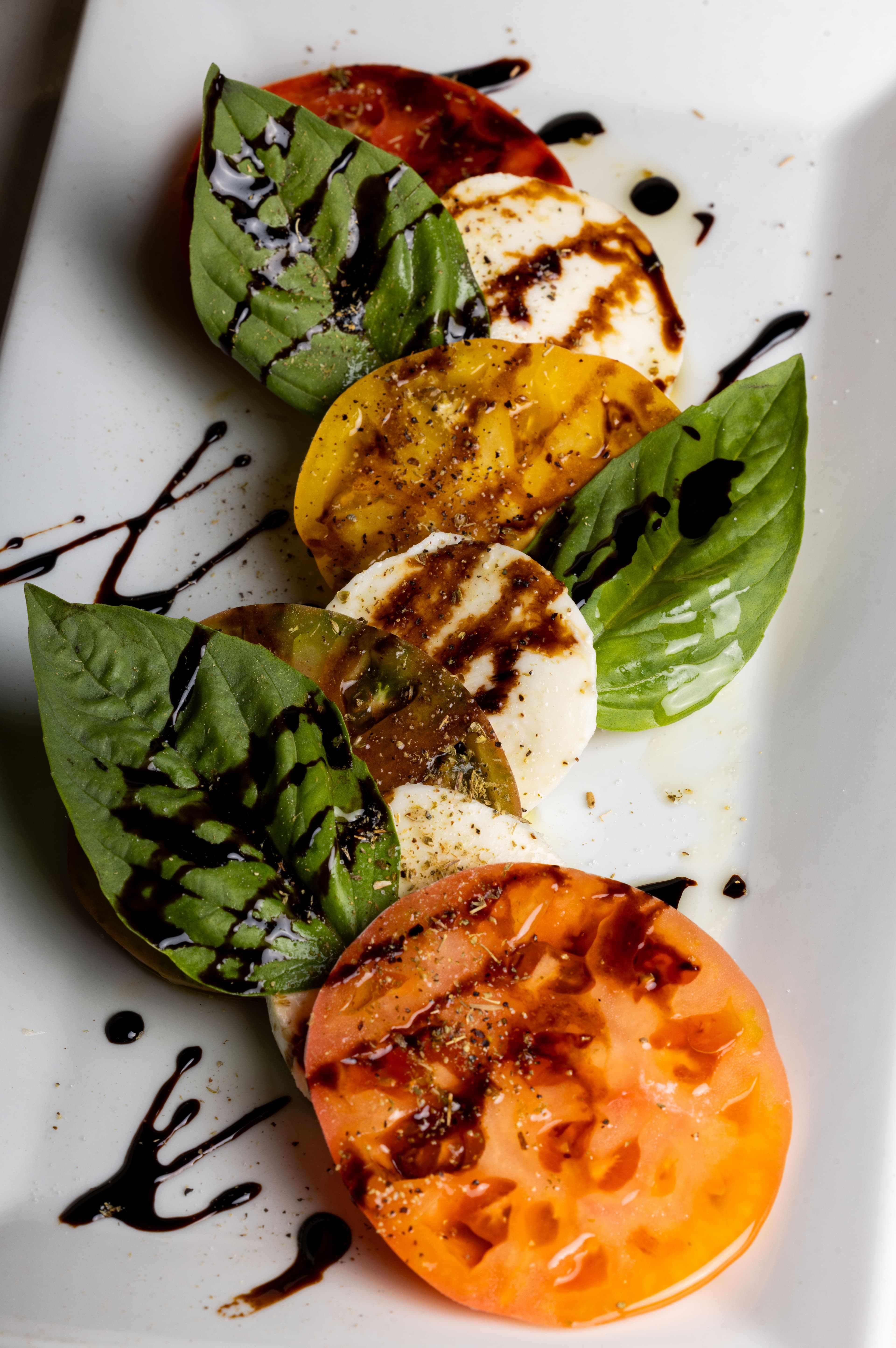 Heirloom tomato caprese with fresh mozzarella, basil and balsamic