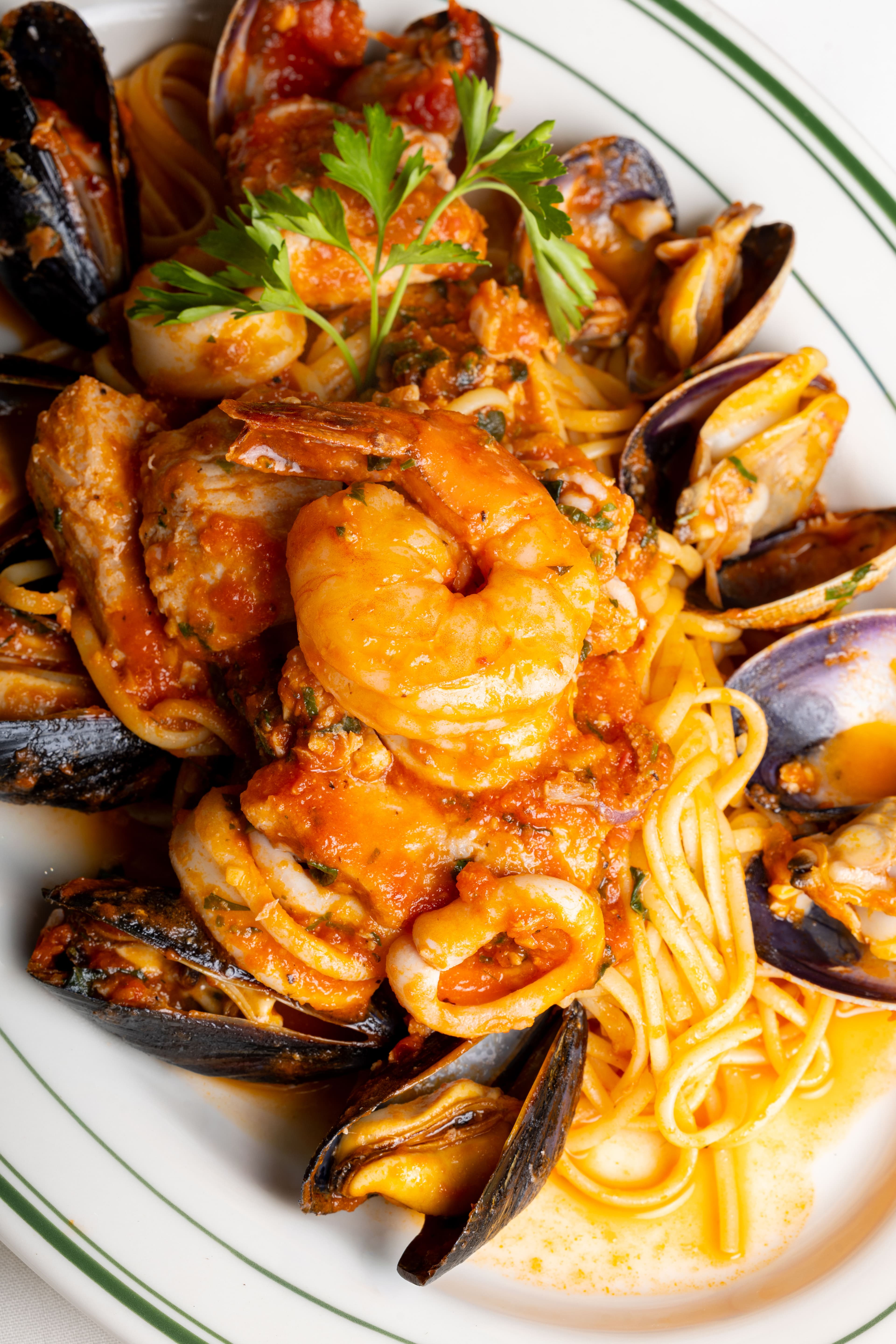 Seafood linguine with shrimp, mussels and clams in tomato sauce
